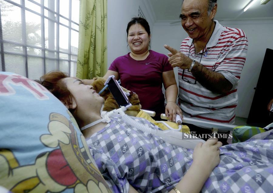 Girl remains positive two years after spinal tumor left her paralysed